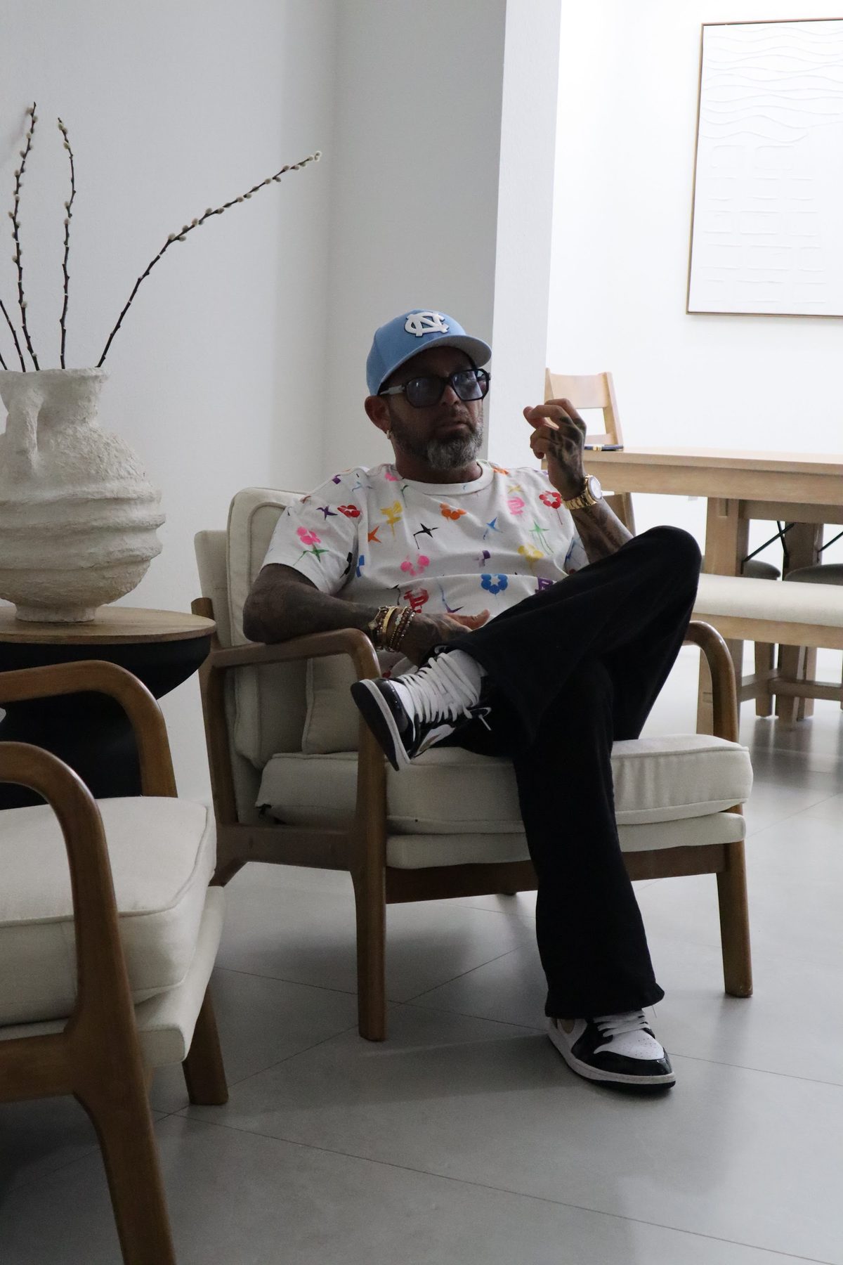 David Sugarman seated in a Miami living room